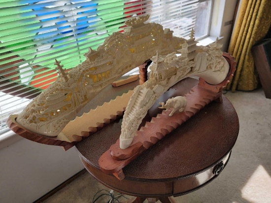 2 RESIN TUSK CARVINGS