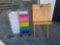 SMALL CHILDRENS EASEL WITH ROLLING STORAGE BIN RACKS