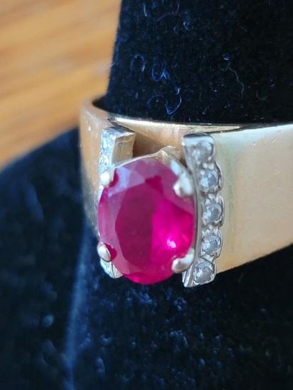 14K RING WITH 1 LARGE RUBY AND 10 SMALL DIAMONDS
