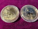 TWO SILVER COMMEMORATIVE STATUE OF LIBERTY HALF DOLLARS