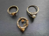 2 GOLD RINGS AND SINGLE CHARM