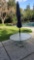TWO OUTDOOR GLASS TABLES