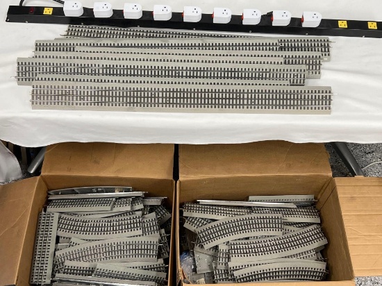 LARGE LOT OF LIONEL TRAIN TRACK WITH POWER STRIP