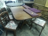 Dining room table with 4 chairs, extra leaves & table cover (lot 10)