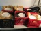 6 milk crates with various dishes, mostly dinner plates