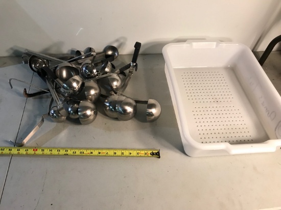 Large assortment of soup ladles and strainer tote