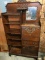 WOW.  Beautifully Crafted Antique Secretary, with carved accents, adjustable shelves, on casters.