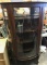 Bow Front Glass Curio Cabinet, on casters.  Appears to be all original,