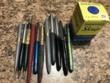 Various vintage pens and pencils.  Names include Parker, Sheaffer, Estebrook and more.  Ink bottle i