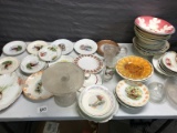 Large lot of mismatched china dishes, serving bowls, and plates