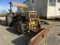 FORD INDUSTRIAL TRACTOR W/ TRENCHER AND FRONT BLADE , HOURS SHOWING: 2836
