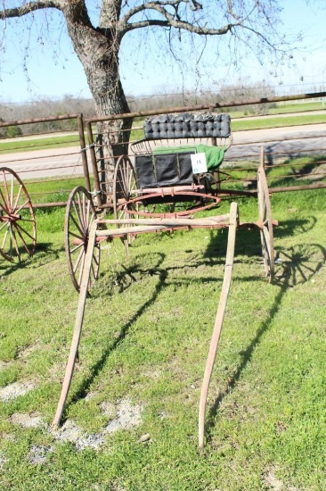 4 WHEEL HORSE DRAWN BUGGY, 1 SEATER, WOODEN WHEELS, INCLUDES SOME OF THE LEATHER HARNESS
