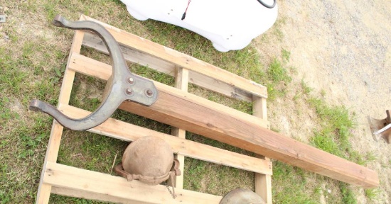 ANTIQUE DINNER BELL MOUNTED ON A WOODEN POST