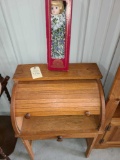 small oak roll top cabinet and pocelain doll
