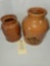 TWO REDWARE POTTERY CANNING JARS ONE WITH PARTIAL BICARBONATE TAG