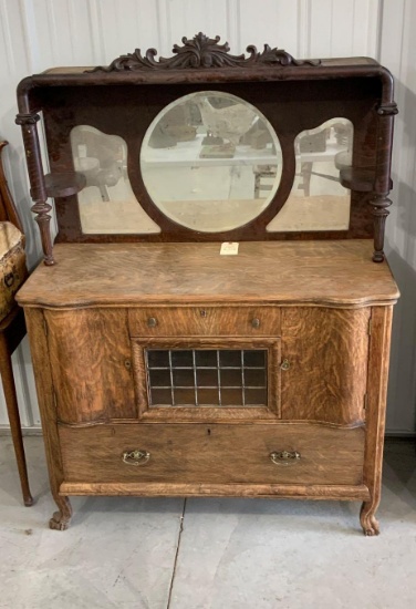 QUARTERSAWN OAK SIDE BOARD BUFFET WITH WITH CARVED TOP, BEVELED MIRROR AND LEADED GLASS FRONT