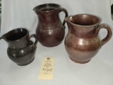 THREE HANDLED CLAY POTTERY PITCHERS