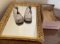 Vintage baby shoes and a mirrored tray