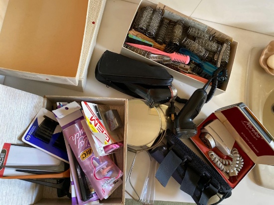 Electric razors, mirrors, curlers, and miscellaneous combs and razors