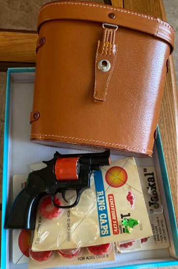 Cap gun with caps and binocular case