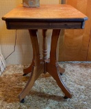 Antique wooden table on casters