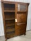 Antique drop front secretary with side curio on casters