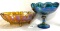 Amber carnival glass footed bowl and blue carnival glass compote