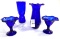 Two cobalt blue fountain sundae glasses, to cobalt blue vases