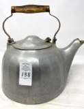 Antique tea pot with wooden handle