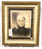 Antique photograph of an elderly woman In gold frame