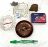 Ashtrays, metal whistles, Coke opener, cowbell, and advertising piece