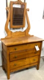 Antique three drawer dresser with mirror