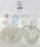 Four advertising shot glasses, 1 glass adv. bed pan, glass frog