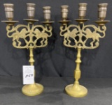 Two antique brass lion candelabras