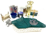 Miniature brass doll bed with doll, vase, flask and misc.