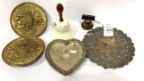 Two antique brass wall pockets, two bells, hot plates