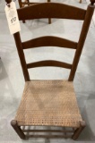 Antique ladder back chair with caned bottom seat