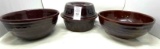 Three brown crock bowls (one with lid)