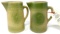 Two decorated crock pitchers