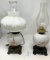 Two milk glass, decorated oil lamps, one electrified