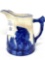 Sleepy Eye pottery pitcher with blue band on top