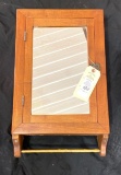 Antique wooden medicine cabinet with mirror and towel bar