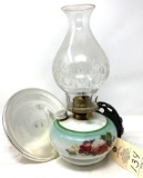 Painted oil lamp with cast iron wall bracket