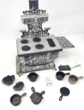 Child's size eagle cast iron stove and pans