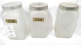 Three frosted clear glass cannister jars