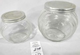 Two small glass cannisters w/lids