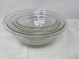 Three Pyrex clear nest of bowls