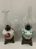 Two decorated oil lamps