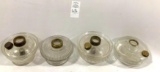 Four clear gas lamp bases