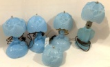Four blue boudoir lamps and one extra shade
